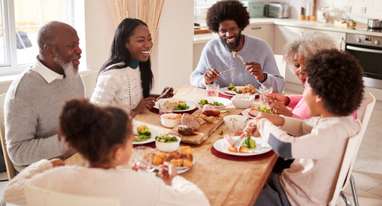 young family eating meal together at kitchen table